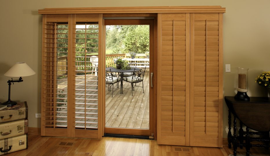 Bypass wood patio door shutters in Gainesville living room